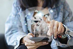 Concept of data cloud computing. Woman using smartphone and Pointing finger to cloud icons. connect devices information technology