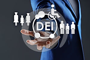 Concept of DEI - Diversity, Equality, Inclusion. Businessman showing virtual image of people, person with disability and