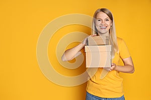 Concept of delivery, surprise, gift, young woman and cardboard boxes
