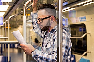 Concept of determination, commitment. Smart scholar wearing glasses in public transport