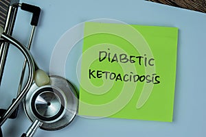 Concept of Diabetic Ketoacidosis write on sticky notes with stethoscope isolated on Wooden Table photo