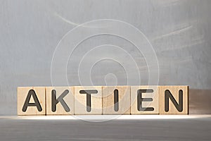 Concept of dices with letters forming word: Aktien - German for Stock