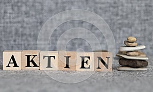 Concept of dices with letters forming word: Aktien - German for Stock