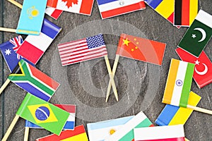 The concept is diplomacy. In the middle among the various flags are two flags - USA, China