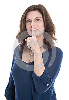 Concept discretion: isolated mature woman touching finger on mouth. photo