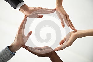 Concept of diverse business people join hands forming circle.
