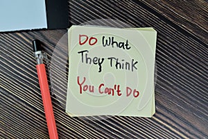 Concept of Do What They Think You Can`t Do write on sticky notes isolated on Wooden Table
