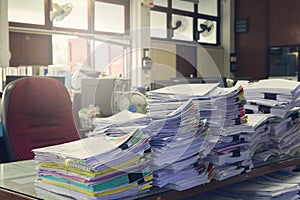 Concept of document workload, Pile of unfinished documents on office desk, Stack of business paper