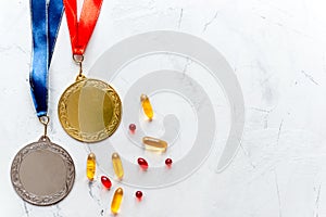 Concept of doping in sport - deprivation medals top view