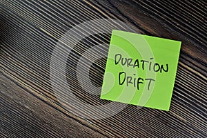 Concept of Duration Drift write on sticky notes isolated on Wooden Table