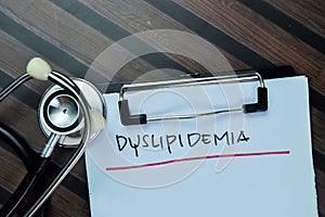 Concept of Dyslipidemia write on paperwork isolated on Wooden Table photo