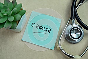 Concept of E-Health write on sticky notes isolated on Wooden Table