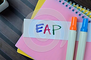 Concept of EAP write on sticky notes isolated on Wooden Table
