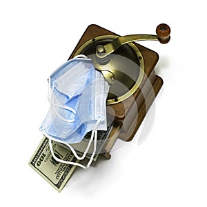 the concept of earning money on a pandemic in a manual coffee grinder medical masks are ground and the output is cash