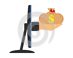 The concept of earnings and income from the Internet. A hand holds out a bag of money from a computer monitor screen. Side view.