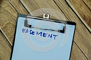 Concept of Easement write on paperwork isolated on Wooden Table photo