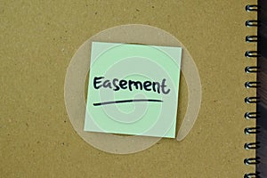 Concept of Easement write on sticky notes isolated on Wooden Table photo