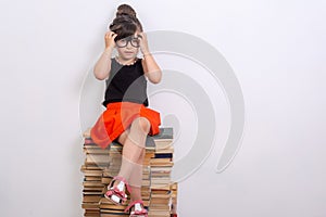 Concept of education and reading. Industrious child. Little Girl reading the book.