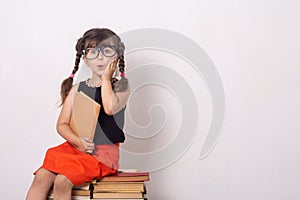 Concept of education and reading. Industrious child. Little Girl reading the book. photo