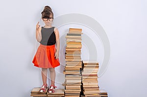 Concept of education and reading. Industrious child. Little Girl reading the book. photo