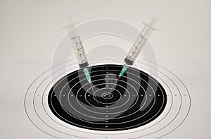 The effectiveness of vaccination. Medical disposable syringes and a target