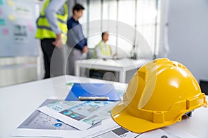 Concept of engineering meeting with protective helmet for competent engineer.