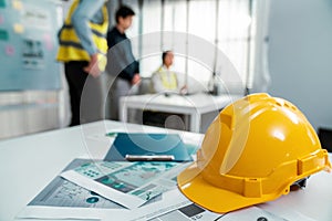 Concept of engineering meeting with protective helmet for competent engineer.