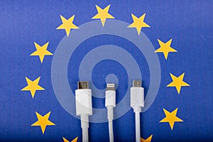 Concept for EU law to force USB-C chargers for all phones. EUROPEAN UNION flag and USBC universal