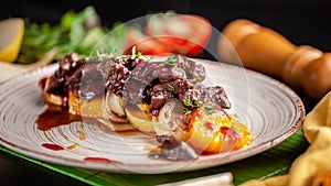 The concept of European cuisine. Grilled beef liver with caramelized fruit, pear, orange and onion. Serving dishes