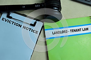 Concept of Eviction Notice and Landlord - Tenant Law write on book isolated on Wooden Table