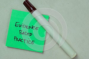 Concept of Evidence Based Practice write on sticky notes isolated on Wooden Table