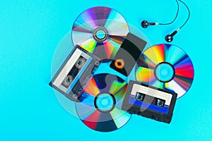 The concept of the evolution of music. Cassette, CD-disk, mp3 player. Vintage and modernity. Music support.