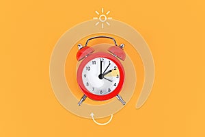 Concept for explaining summer daylight saving time with clock and arrow