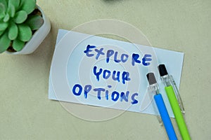 Concept of Explore Your Options write on sticky notes isolated on Wooden Table