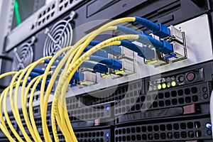 Concept of fast broadband access to the network. A bunch of fiber-optic Internet wires are connected to the router modules. Yellow photo