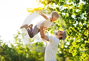Concept of father`s day! happy family dad and child daughter    in nature photo