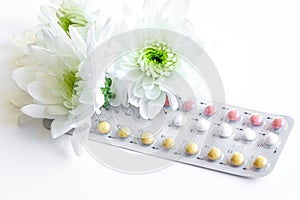 Concept of female contraception on white background