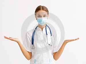 Concept of fighting and prevention coronavirus infection covid 19. woman doctor in protective medical  mask  spreads   arms out to photo