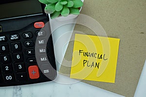 Concept of Financial Plan write on book isolated on Wooden Table