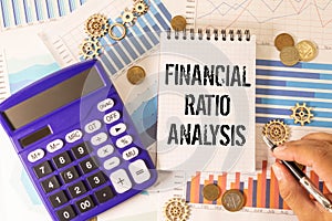 Concept of Financial Ratio Analysis write on sticky notes isolated on Wooden Table