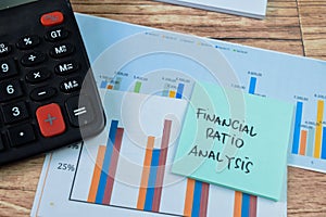 Concept of Financial Ratio Analysis write on sticky notes isolated on Wooden Table