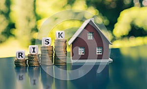 Concept of the financial risk to buy a house. Dice form the word