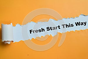 Concept of Fresh Start This Way Text written in torn paper