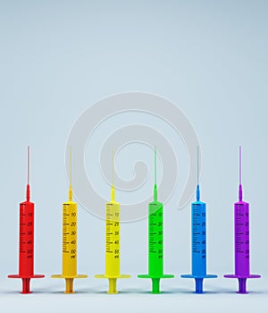 Concept on gay pride day, LGBTIQ PRIDE with colored medical syringes on light background. pride day, free love, gay day, lesbian