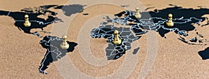 concept of geopolitics or worldwide economy. chess figures placed on map banner photo