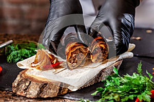 The concept of Georgian cuisine. Recipe for cooking meat lyulya kebab in the dough on the grill. Chef puts meat on a skewer