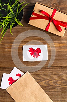Concept of gift cards on wooden background top view
