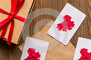 Concept of gift cards on wooden background top view