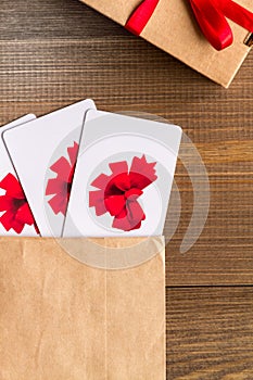 Concept of gift cards on wooden background top view