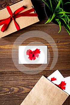 Concept of gift cards on wooden background top view